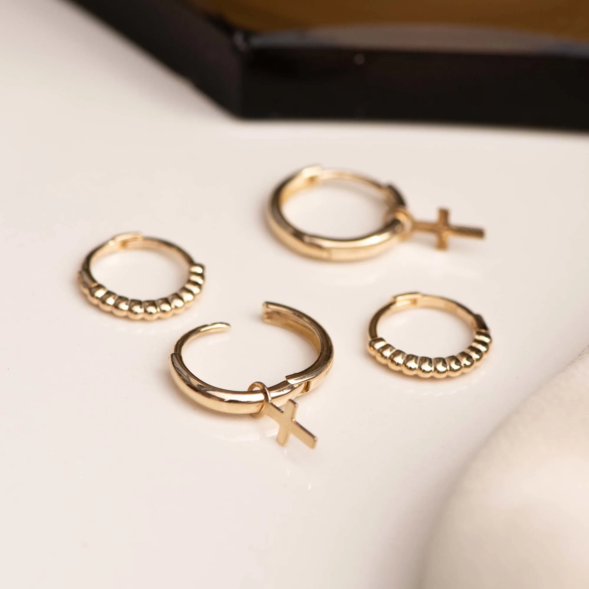 Monceau Solange 14 karat gold hoop earrings with cross